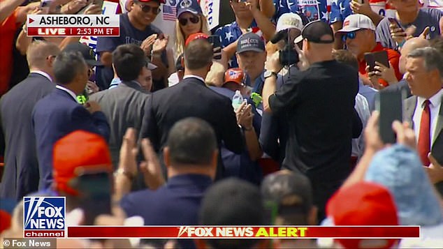 Trump hugs one of his supporters who needed medical attention