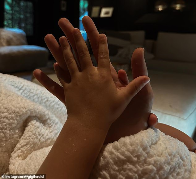 Gigi gave fans a glimpse into her life as a mom, adding another adorable photo as she compared her daughter's hand sizes