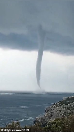 A towering waterspout was captured on camera off the coast of Salento