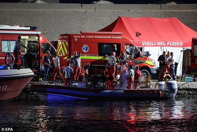 Rescue workers and divers from the Italian fire brigade work through the night as the rescue operation for the missing people on board continues