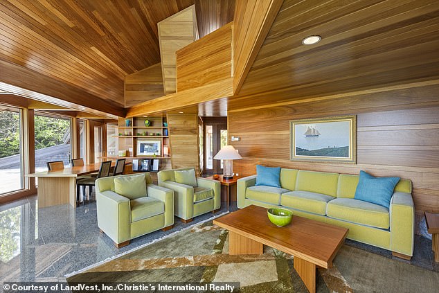 Located on Buckmaster Neck in Stonington, the 5,000-square-foot home was designed by local architect James W. Schildroth (pictured: the living and dining room)