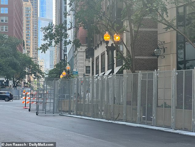 The raised security fences ran for blocks, cutting off many businesses from pedestrian traffic