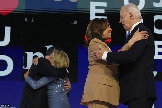 President Joe Biden embraces Democratic presidential nominee Vice President Kamala Harris as first lady Jill Biden embraces second in command Doug Emhoff during the first day of the DNC