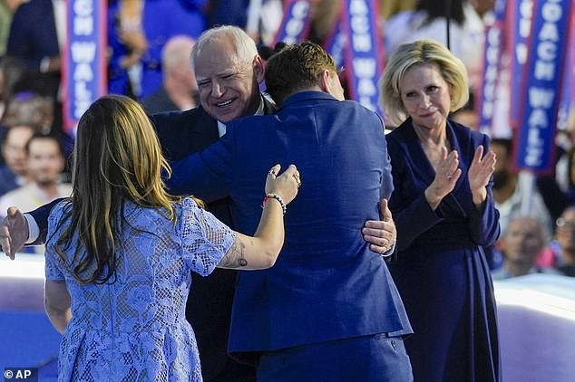 Walz embraced by his son Gus after delivering his acceptance speech at the Democratic National Convention