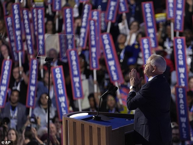 Walz's speech was heavy on football metaphors and references to his time as a public school teacher. As he spoke, supporters in the crowd held up signs that read 