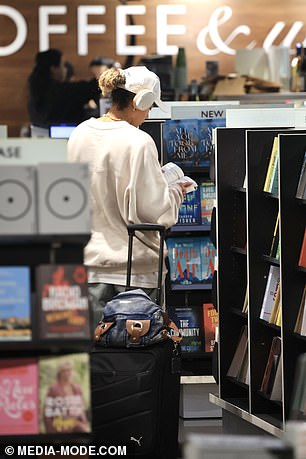 Fowler packed light with a small carry-on suitcase and a backpack