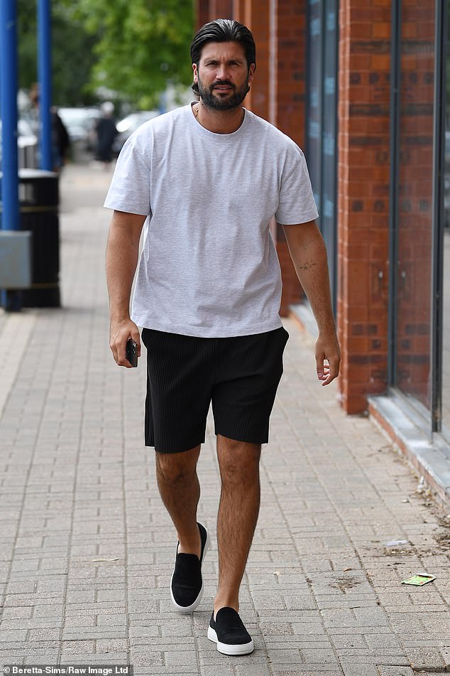 Meanwhile, Dan opted for a casual plain gray T-shirt with black shorts and loafers