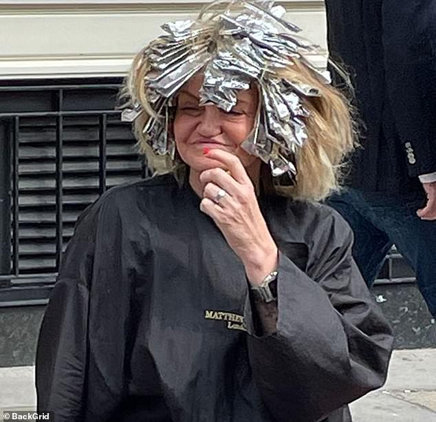 The Big Brother star looked in good spirits as she was spotted taking a break from the hairdressers with a head full of foils after getting her hair highlighted