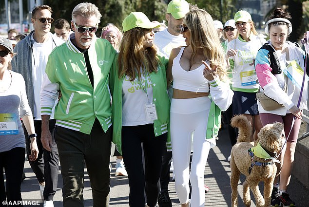 Chloe appeared at Walk for Wellness last year. Pictured: Chloe with Olivia's husband John Easterling and Olivia's niece Tottie Goldsmith