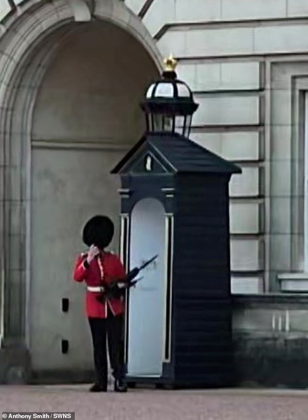 The Royal Guard quickly adjusted their hats before going about their normal business