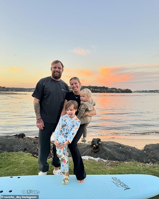 'Kurt and I just need to agree on his middle name now. Kurt has already fallen in love with a name, but it's two syllables and I don't think it would flow as well as a one-syllable name.' Sarah is pictured with her husband Luke Tilse and her children Fox Ocean, 5, and Malakai Koa, 2