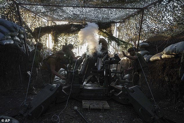 Ukrainian servicemen from the 148th Separate Artillery Brigade of the Air Assault Troops fire on Russian positions with an M777 howitzer at the front in the Donetsk region, Ukraine