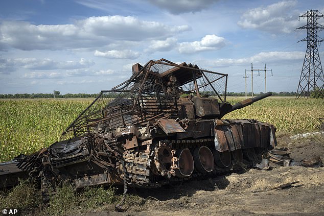 A destroyed Russian tank stands on the side of the road near the town of Sudzha, Russia, in the Kursk region, on August 16, 2024