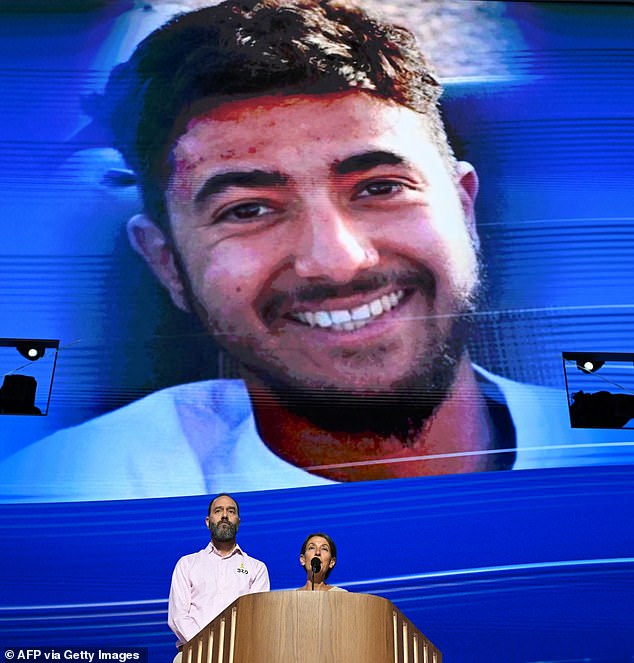 The couple, pictured last night addressing delegates at the DNC as their son's photo was projected above them, largely stayed away from politics in their 10-minute speech, but Jon Polin (left) said the families of the American hostages meet regularly in Washington and were encouraged by the bipartisan support for securing the release of their loved ones.