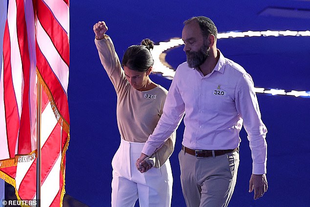 Jon Polin and Rachel Goldberg, parents of Gaza hostage Hersh Goldberg-Polin, leave the stage after a speech on Day 3 of the DNC in Chicago