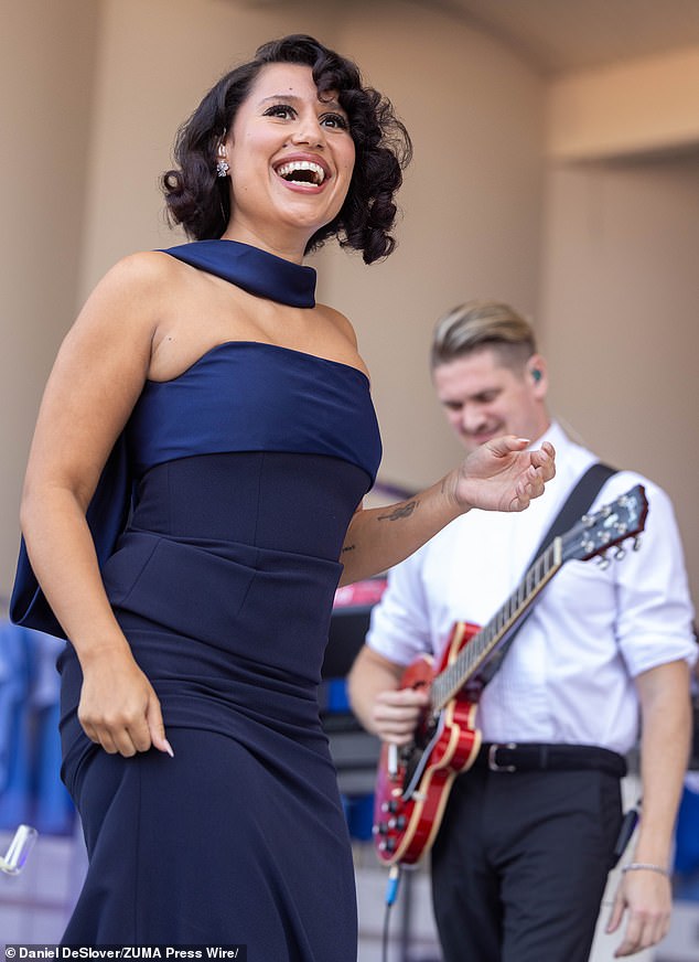 Raye's excitement comes after she looked absolutely sensational in a navy blue dress while performing at the Lollapalooza Music Festival in Grant Park in Chicago, Illinois earlier this month