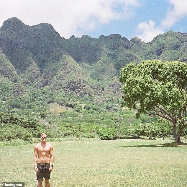 Happy to be dwarfed by the vast lush green mountains, Jett posed shirtless for Lily, with his hands in his pockets as his toned abs got some sun