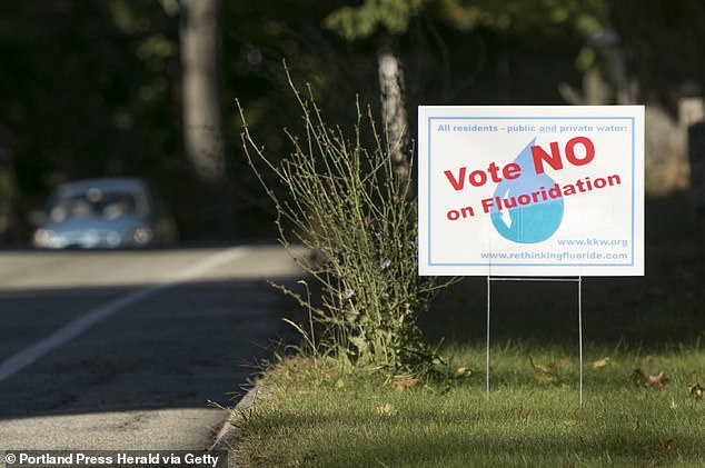 There has been controversy over fluoride in drinking water supplies for years, with hundreds of communities voting against its use (above is a campaign sign from Kennebunk, Maine)