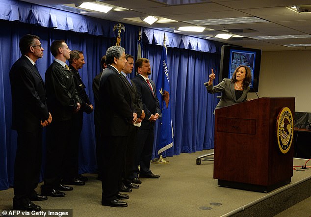 California Attorney General Kamala Harris briefs media with law enforcement officials