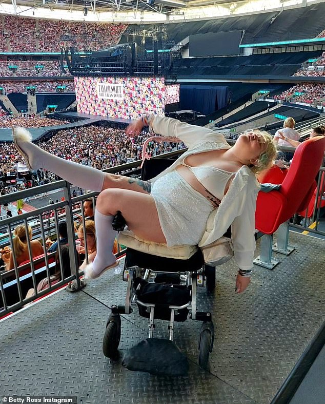 Betty, 33, who suffers from fibromyalgia - a condition that causes pain all over the body - put on a daring show in a glittering bralette and shorts as she posed in her electric wheelchair at Wembley Stadium