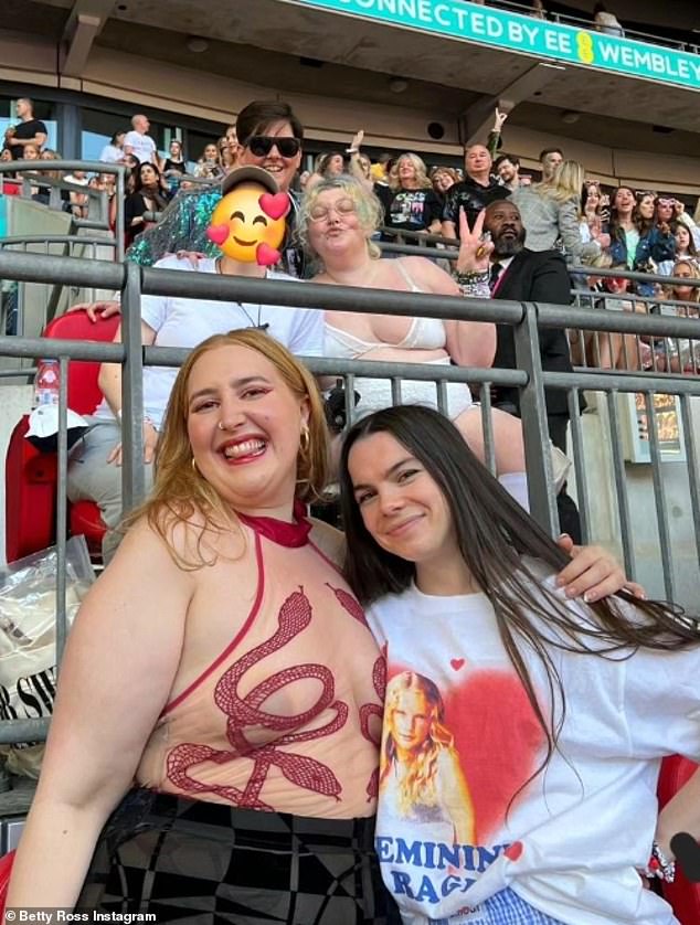 She posed with her younger sister Honey, 27, who looked trendy in a daring sheer bodysuit with a red snake down the front