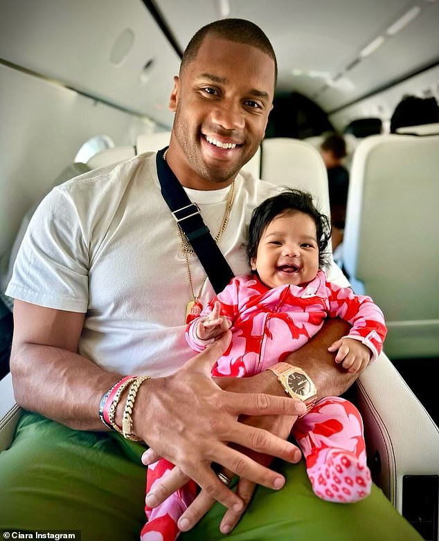 The 38-year-old Can't Leave 'Em Alone hitmaker and the athlete welcomed their fourth child, daughter Amora Princess, in December 2023; Russell and Amora seen in 2024