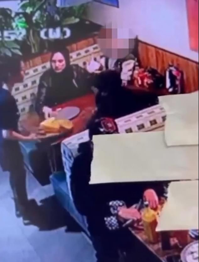 The video footage shows the waitress placing a plate of food on the table seconds before she was attacked by the man