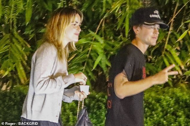 The duo were photographed hanging out at the valet parking outside the San Vicente Bungalows