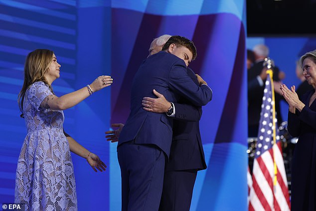 Tim Walz embraces his son, Gus Walz, during the third night of the Democratic National Convention