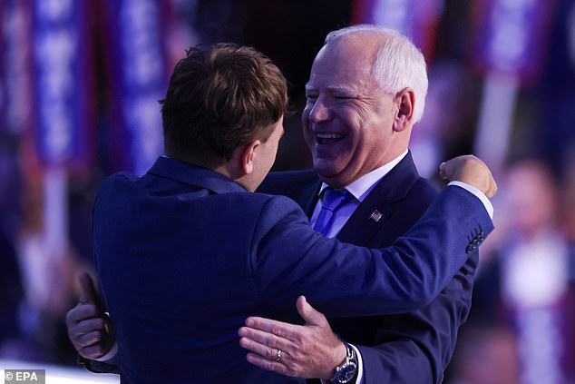 Tim Walz and his son Gus embrace after his acceptance speech