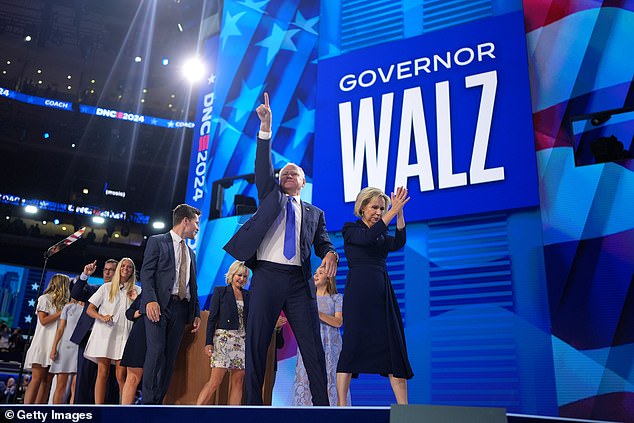 Tim Walz and his wife Gwen leave the stage together after his primetime speech