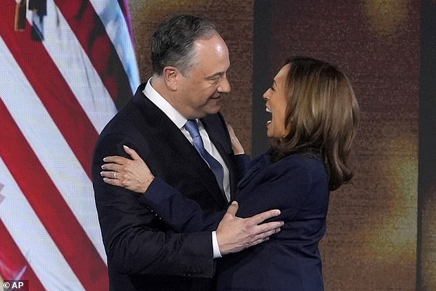 Emhoff and Harris embrace onstage at the DNC Thursday