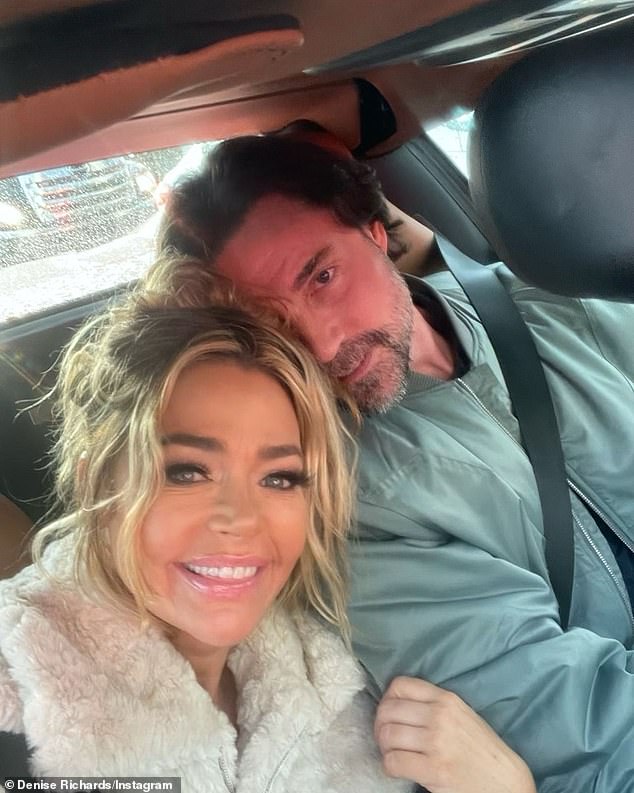 Moments earlier, the Hunting Housewives actress and her second husband Aaron Phypers (right, pictured in 2022) discovered a bullet hole in the side of their Ford F-150 Shelby truck after being cornered by a 