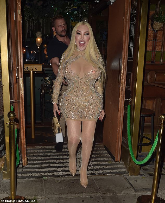 The 41-year-old TV personality looked as glamorous as ever in a semi-sheer mesh mini dress