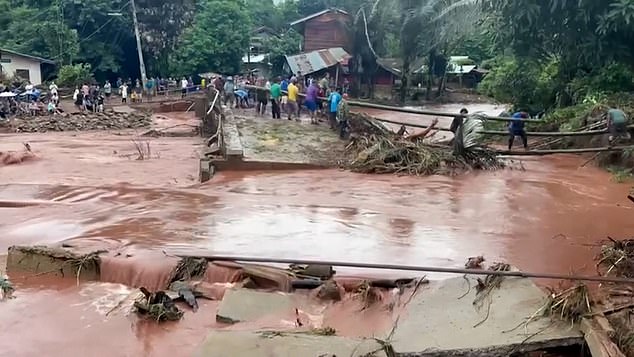 Water covers street after heavy rain overnight caused landslide and flooding