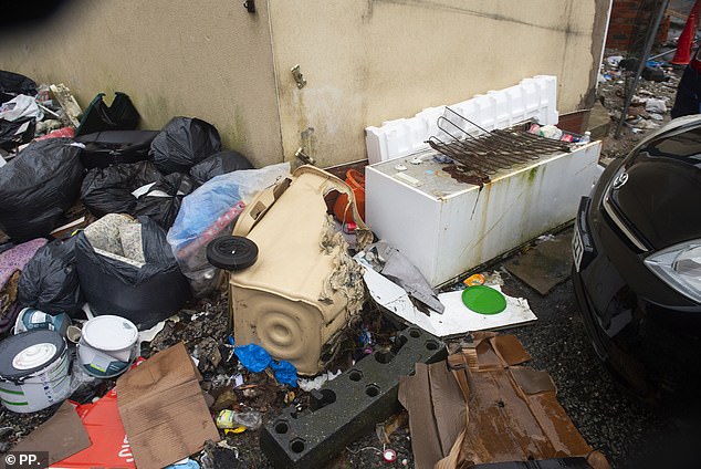 An old trash can and a broken refrigerator were dumped at the location weeks before the opening in May