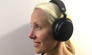 Senior staffer Becky Scarrott wears the Sennheiser Momentum 4 Wireless on a white background