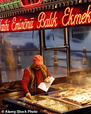 'Searching for the best kebab in Istanbul is a lifelong odyssey for some,' says Rob. Above, a food vendor in Eminonu, Istanbul