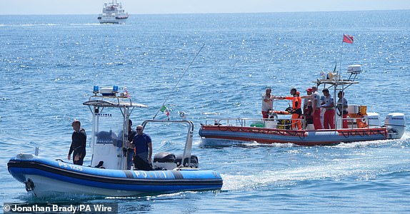 A diving team from Italy's fire brigade returns to port on the fifth day of a search and recovery operation after the luxury yacht Bayesian sank in a storm on Monday while moored about half a mile off the coast of Porticello, Sicily. The search for the last person missing from the wreck of the yacht continues after five bodies were brought ashore in the small fishing village of Porticello. Date Pictured: Friday 23 August 2024. PA Photo. Technology magnate Mike Lynch, his daughter Hannah, Morgan Stanley International bank chairman Jonathan Bloomer, his wife Judy Bloomer, Clifford Chance lawyer Chris Morvillo and his wife Neda Morvillo went missing when the Bayesian sank at around 5am on Monday. See PA story ACCIDENT Italy. Photo credits should read: Jonathan Brady/PA Wire