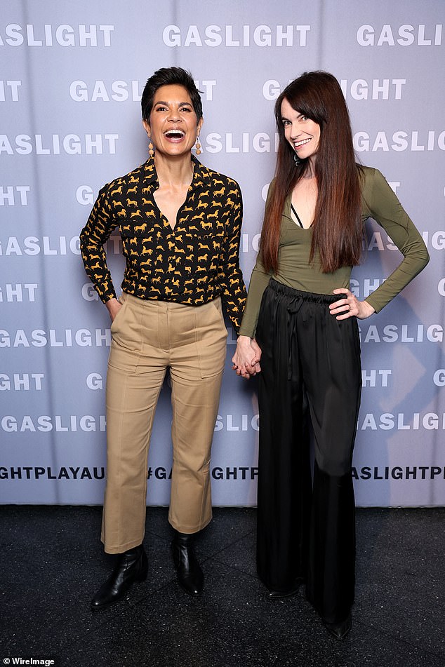 The women exchanged warm glances and laughed together as they posed for photos holding hands