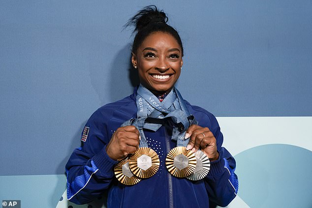 She won three golds - in the team event, the all-around and the vault - and won silver on the floor