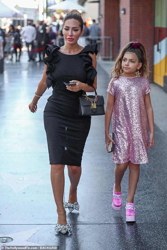 Instead of the bright colors, tulle skirts, and glittering sequins that Sophia once favored, she now prefers to wear all-black, gothic-style outfits; pictured with her mother in Hollywood in 2019