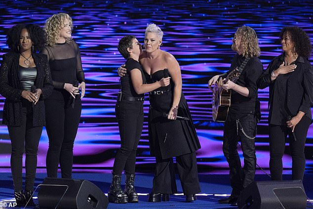 The mother-daughter duo were dressed in all-black ensembles and stood side by side under the bright spotlights on stage