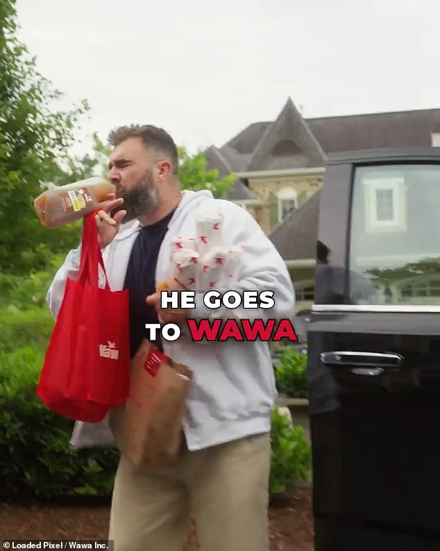 The ad features Kelce holding an armful of sandwiches and drinking iced tea as he heads home