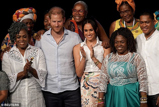 Prince Harry joined his wife Meghan on stage after she spoke at an event focused on the empowerment of Afro-Colombian women