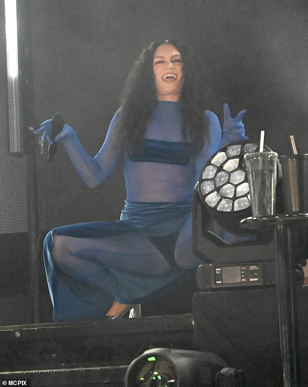 The 36-year-old Price Tag singer looked sensational in the blue bodysuit that left little to the imagination and showed off her toned stomach