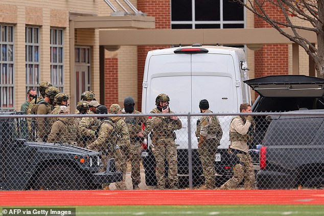 SWAT team members are deployed to the Congregation Beth Israel synagogue in Colleyville, Texas