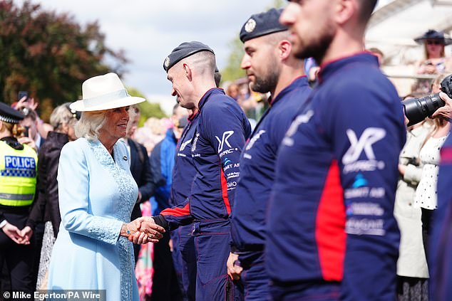 Pictured: The Royal Family shake hands with members of the parachute team during the fourth day of the Sky Bet Ebor Festival at York Racecourse.