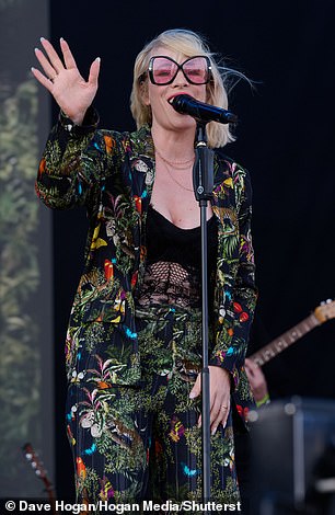 The 42-year-old singer wore an extravagant multi-colored suit with a butterfly print for the event