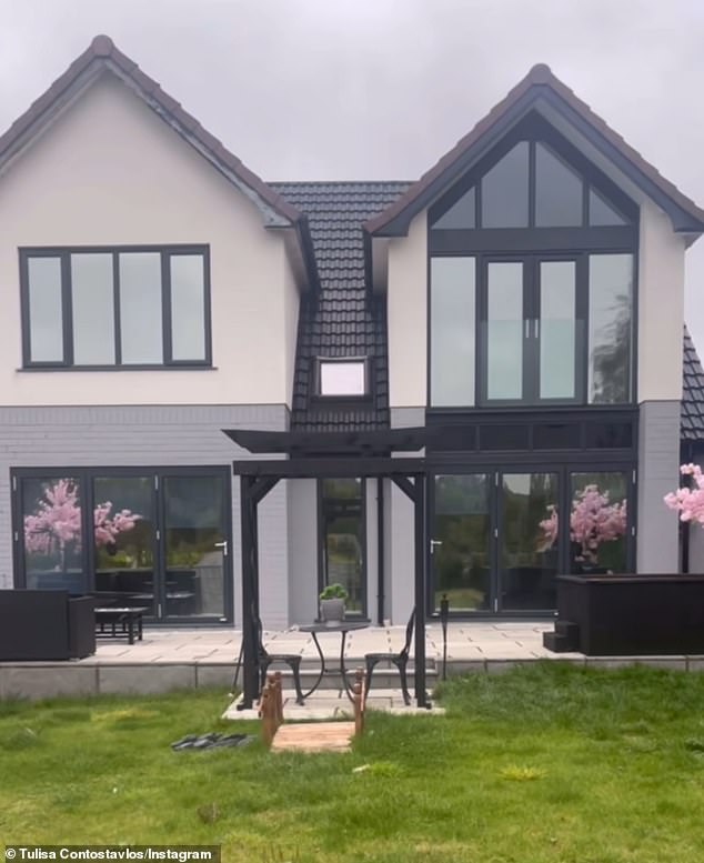 Tulisa uploaded a video of her old red brick home, before showing off the renovated grey slate roof and white exterior